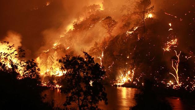 A large fire burning south of Lake Berryessa is threatening structures and closing roads in the area, July 22, 2015. <span class=meta>Matthew Henderson/facebook.com/onfirephotos</span>