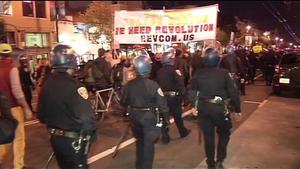 San Francisco police walk alongside protesters in one of many protests over the Michael Brown and Eric Garner rulings.