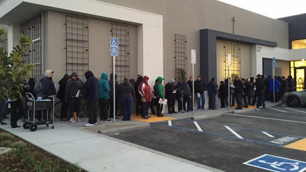 Illegal immigrants line up before dawn for California driver's licenses.