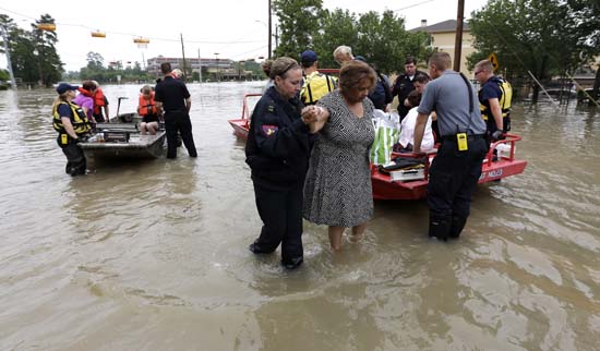 <div class='meta'><div class='origin-logo' data-origin='none'></div><span class='caption-text' data-credit='AP'>Residents are evacuated from their flooded apartment complex</span></div>