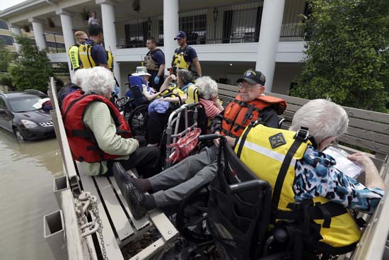 <div class='meta'><div class='origin-logo' data-origin='AP'></div><span class='caption-text' data-credit='AP Photo/David J. Phillip'>Residents of a retirement and assisted living complex are evacuated</span></div>