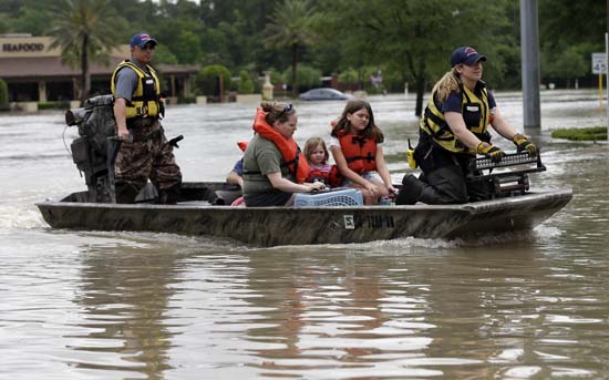 <div class='meta'><div class='origin-logo' data-origin='AP'></div><span class='caption-text' data-credit='AP Photo/David J. Phillip'>Residents are evacuated from their flooded apartment complex</span></div>