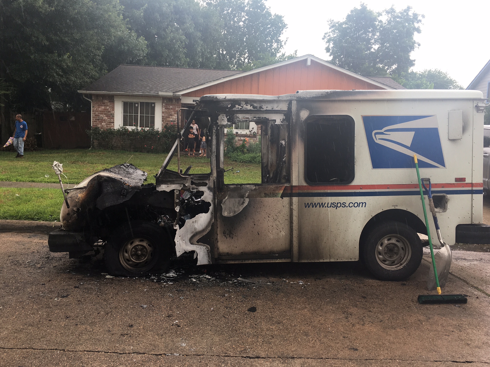 Postal truck erupts in flames after mail carrier smells gas while