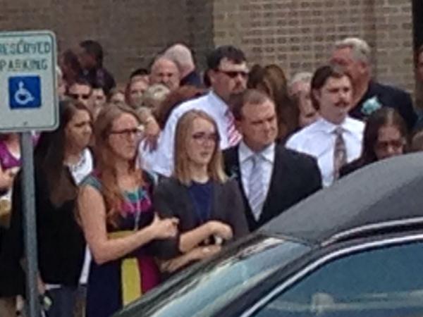 <div class='meta'><div class='origin-logo' data-origin='none'></div><span class='caption-text' data-credit='Photo/ABC-13'>Cassidy Stay in tears outside church as caskets wheeled out.</span></div>