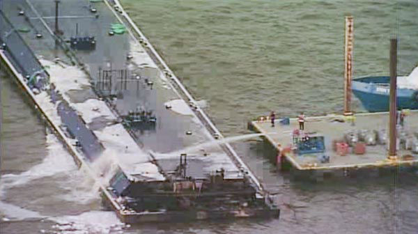 One of the barges, which is hauling petroleum naphtha, caught fire following the collision. An HFD fire boat put out those flames <span class=meta>KTRK Photo</span>