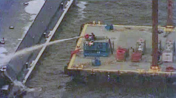 One of the barges, which is hauling petroleum naphtha, caught fire following the collision. An HFD fire boat put out those flames. <span class=meta>KTRK Photo</span>