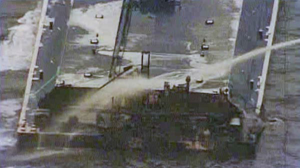 One of the barges, which is hauling petroleum naphtha, caught fire following the collision. An HFD fire boat put out those flames. <span class=meta>KTRK Photo</span>