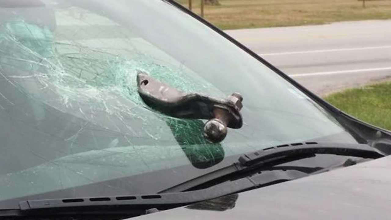 Towing hitch hits windshield