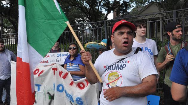 <div class='meta'><div class='origin-logo' data-origin='none'></div><span class='caption-text' data-credit=''>Protesters gather across the street from the site of a Donald Trump fundraiser in River Oaks Friday.</span></div>