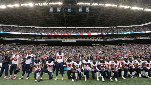<div class='meta'><div class='origin-logo' data-origin='AP'></div><span class='caption-text' data-credit='AP'>Houston Texans players kneel and stand during the singing of the national anthem before an NFL football game against the Seattle Seahawks, (AP Photo/Elaine Thompson)</span></div>