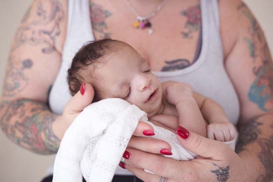 Biological mom keeps baby born with birth defects when ...