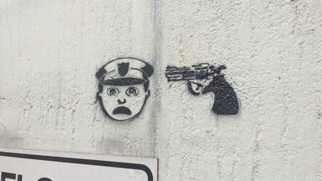 Disturbing graffiti with gun and officer emojis pops up around Houston