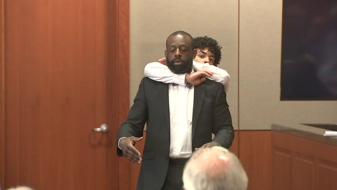 Witness Demonstrates Choke Hold During Trial Over Deadly Fight Outside