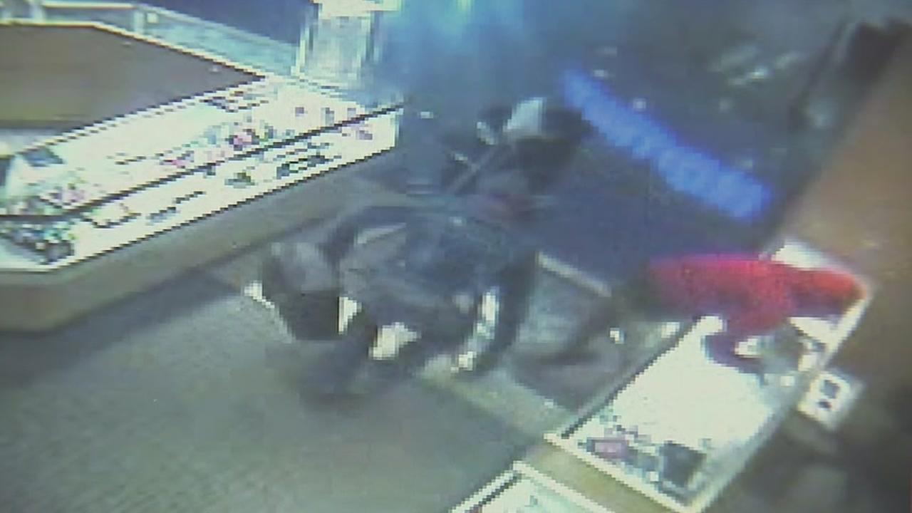 ... smash glass case, steal jewelry from Kay Jewelers at Katy Mills Mall