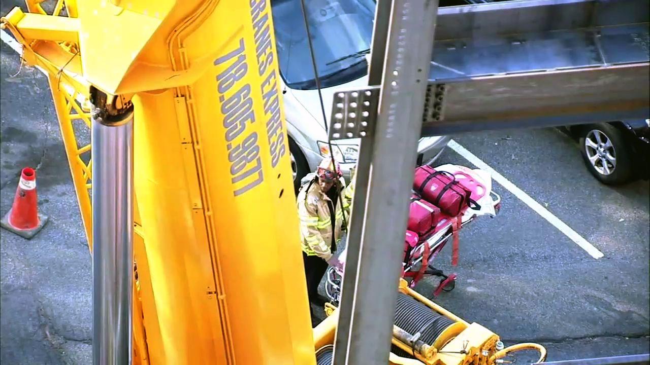 2 workers killed after beam falls onto crane at Queens construction site