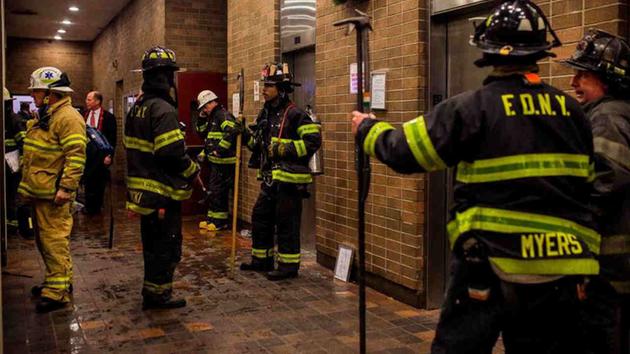 <div class='meta'><div class='origin-logo' data-origin='AP'></div><span class='caption-text' data-credit='Andres Kudacki'>Firefighters gather in the lounge of the building as the fire is under control during a fire on the west side of Manhattan in New York, Thursday.</span></div>