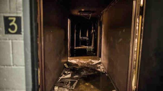 <div class='meta'><div class='origin-logo' data-origin='AP'></div><span class='caption-text' data-credit='Andres Kudacki'>A burnt hallway of the third floor of a building is seen empty after firefighters have extinguished a fire on the west side of Manhattan in New York, Thursday.</span></div>