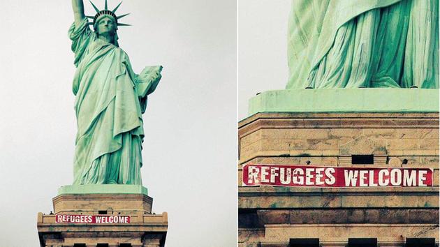 'Refugees Welcome' banner unfurled on Statue of Liberty