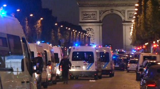 In this image made from video, police attend the scene after an incident on the Champs-Elysees in Paris, Thursday April 20, 2017. 