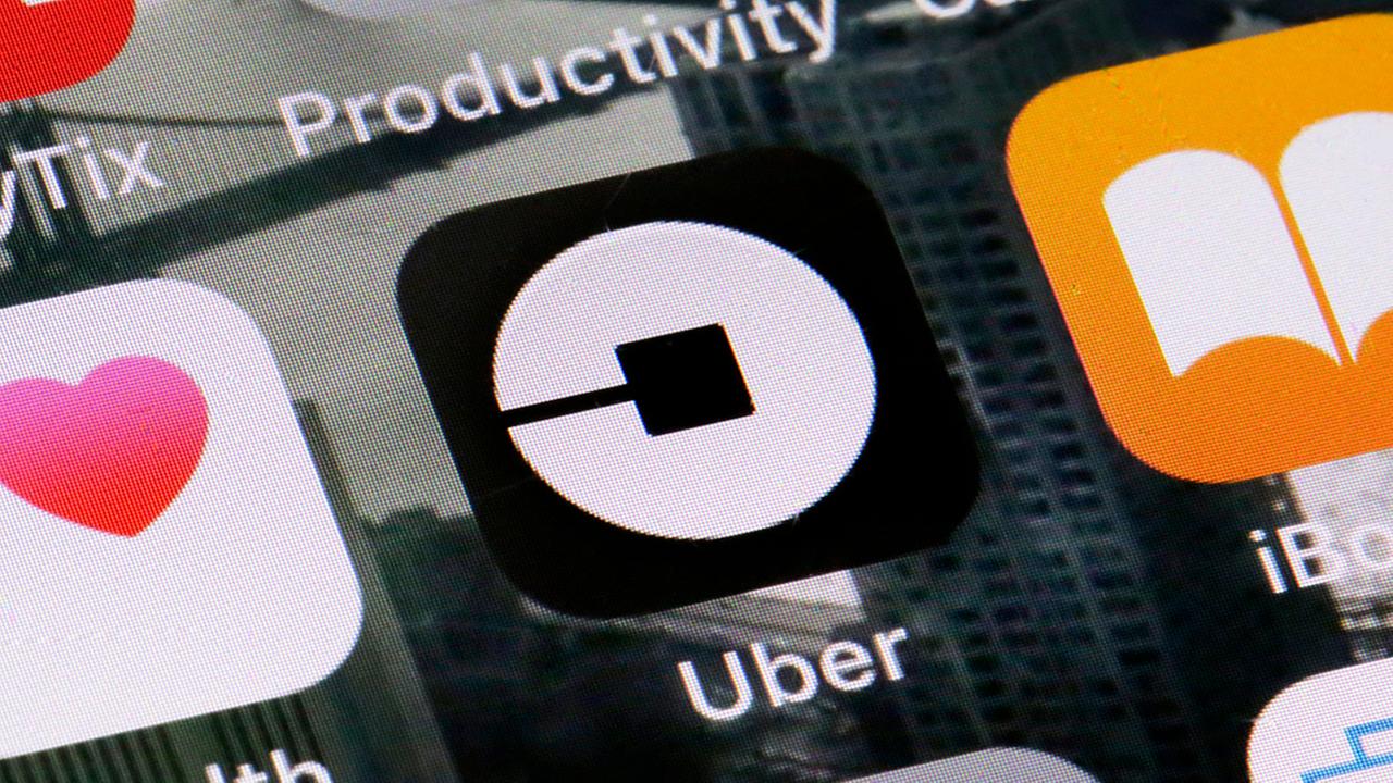 Uber driver who booted 2 kissing women has license suspended