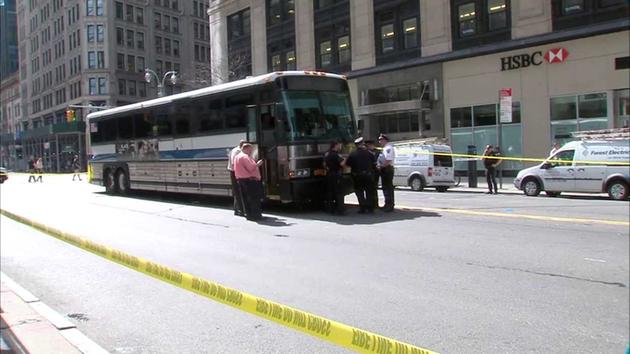 Woman crossing outside crosswalk fatally struck by MTA bus in Midtown