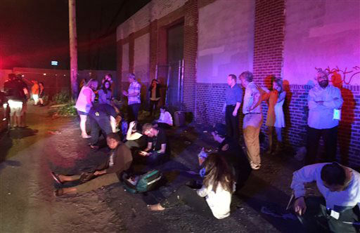 <div class='meta'><div class='origin-logo' data-origin='none'></div><span class='caption-text' data-credit='AP Photo/ Paul Cheung'>Passengers of an Amtrak train that crashed gather Tuesday, May 12, 2015, near Philadelphia. Train 188 was traveling from Washington to New York City. (AP Photo/Paul Cheung)</span></div>