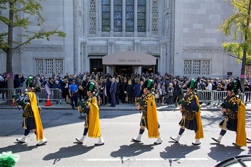 Bagpipers march from the funeral service for comedian Joan Rivers at Temple Emanu-El . (AP Photo/Craig Ruttle) <span class=