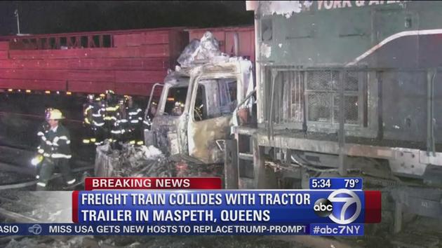 Tractor-trailer, train collide as driver jumps to safety