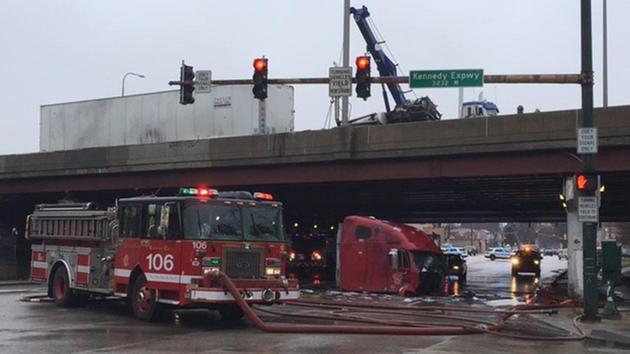 A driver was injured after the cab of his semi-truck fell from an overpass on the Kennedy Expressway.