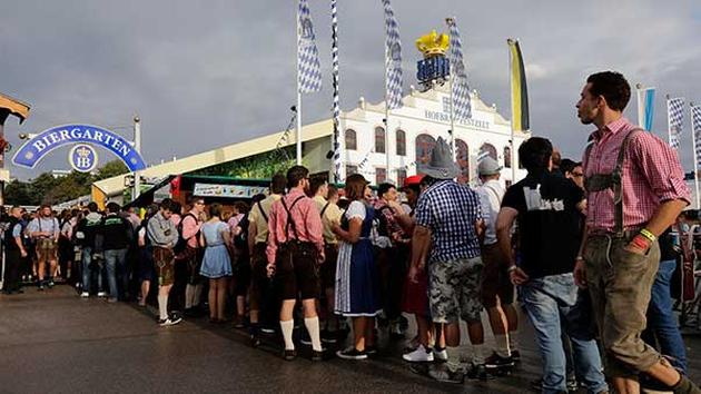 People await the opening of the 181st Oktoberfest beer festival in Munich, southern Germany, Saturday, Sept. 20. <span class=meta>(AP Photo/Matthias Schrader)</span>
