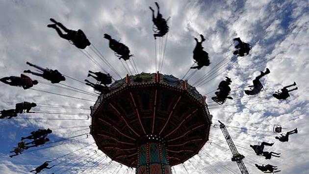 People enjoy a swing ride at the 181st Oktoberfest beer festival in Munich, southern Germany, Saturday, Sept. 20. <span class=meta>(AP Photo/Matthias Schrader)</span>