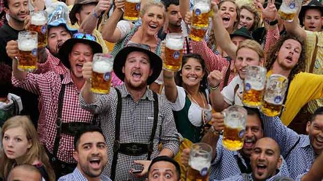 People celebrate the opening of the 181st Oktoberfest beer festival in Munich, southern Germany, Saturday, Sept. 20. <span class=meta>(AP Photo/Matthias Schrader)</span>