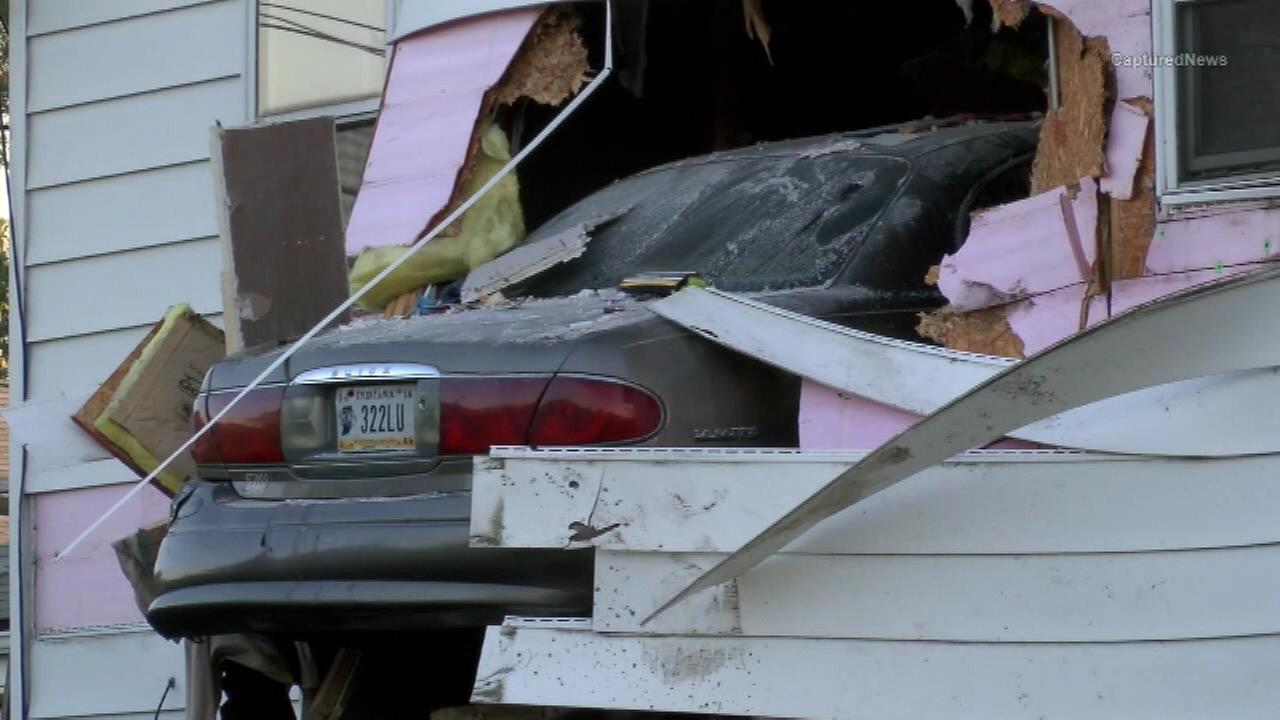 Car crashes into second story of Gary home
