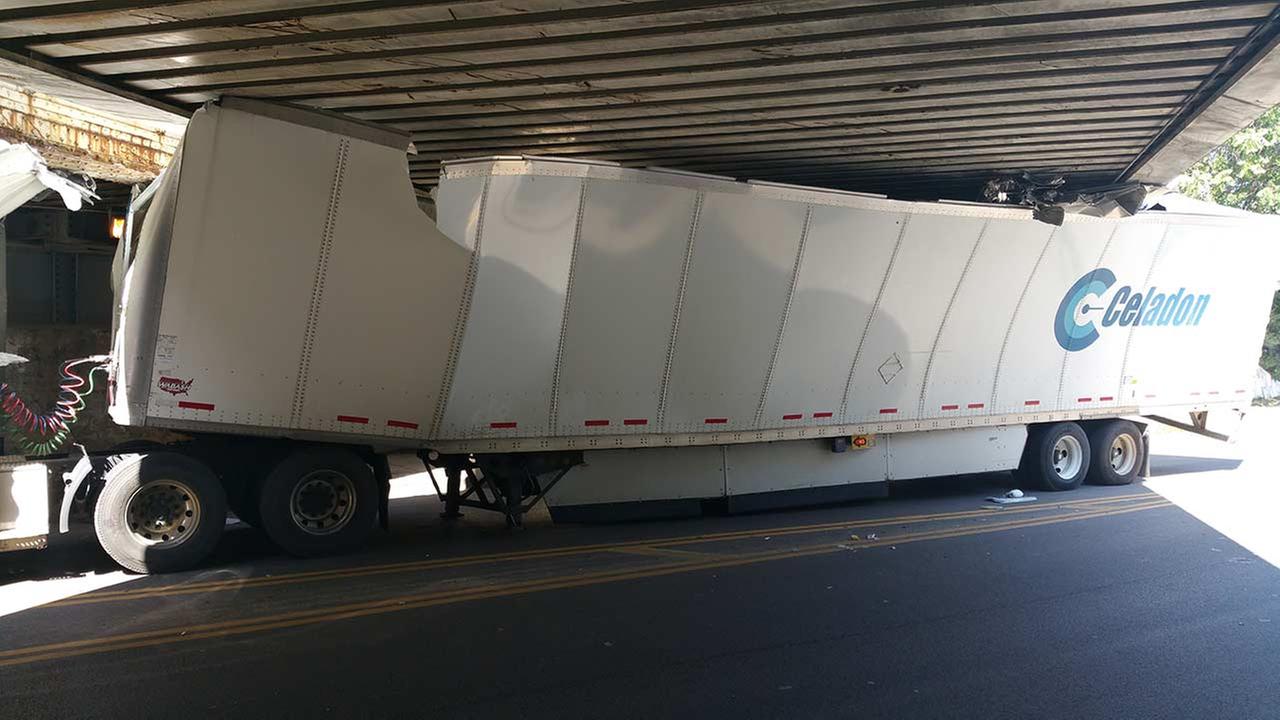 PHOTOS Semitruck stuck in train underpass in McKinley Park