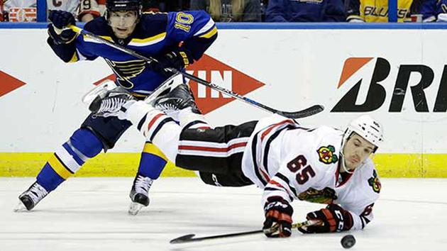 Chicago Blackhawks Andrew Shaw, right, is sent flying during the second period in Game 7 of an NHL hockey first-round Stanley Cup playoff series Monday, April 25, 2016. 