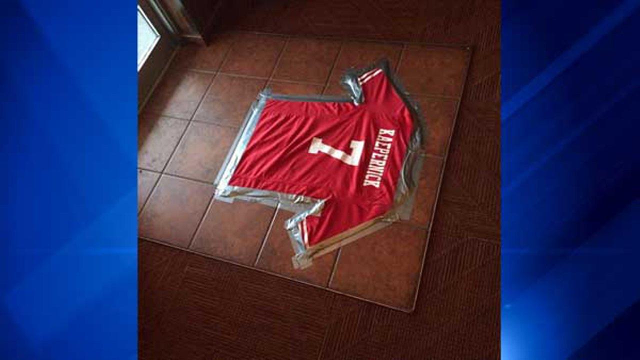 Kaepernick jersey taped to restaurant floor
