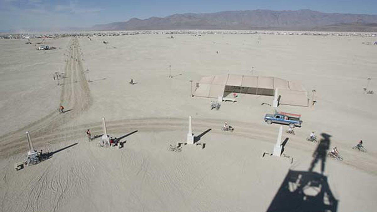 Burning Man participants view The Man on Tuesday, Aug. 26, 2008, at the Black Rock Desert near Gerlach, Nev. 