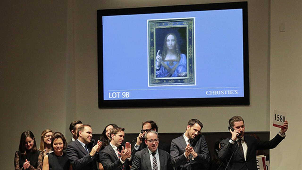 Bidding representatives react after Leonardo da Vincis Salvator Mundi sold for $400 million at Christies Wednesday Nov. 15 2017 in New York