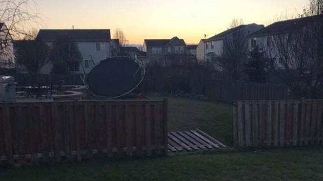 A family's trampoline blew into their neighbor's yard and took down a portion of their fence in far northwest suburban Pingree Grove due to high winds.