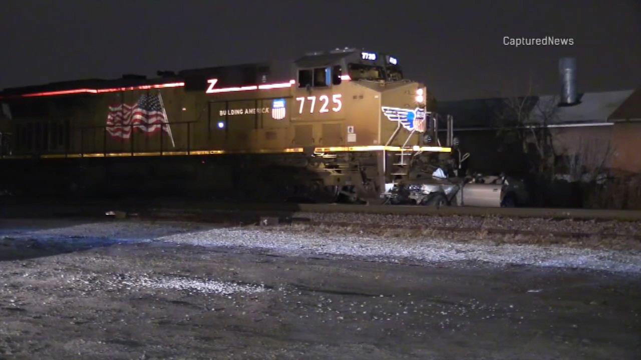 Woman killed, man injured when freight train strikes car in Melrose