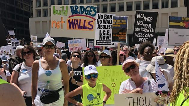 <div class='meta'><div class='origin-logo' data-origin='WLS'></div><span class='caption-text' data-credit='Megan Hickey'>Hundreds gather in the Loop for a protest against President Donald Trump's immigration policy.</span></div>