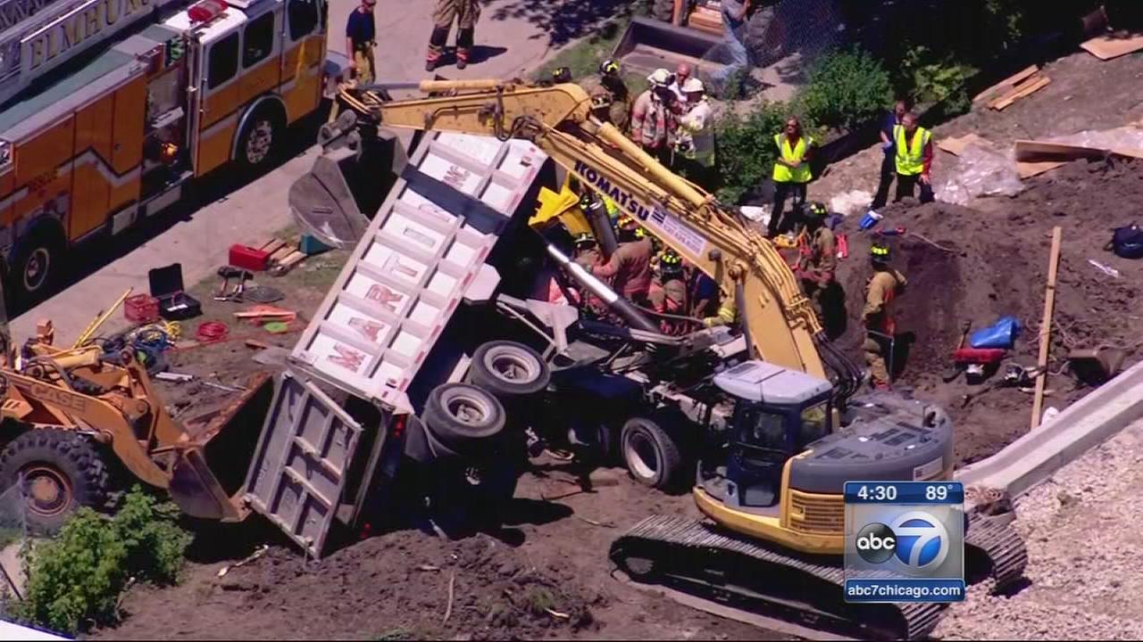 Elmhurst construction worker freed from overturned dump truck