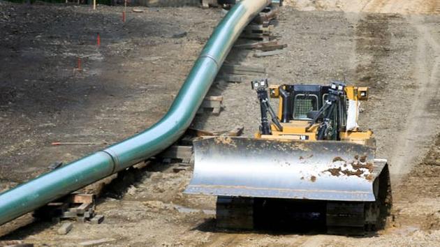 Segments of assembled pipe are lined up along a cleared section of woods where a pipeline for shale gas is under construction on July 8, 2017 in Jackson Township, Butler County, Pa
