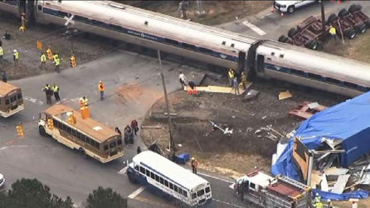 PHOTOS Amtrak train hits big rig, derails in North Carolina
