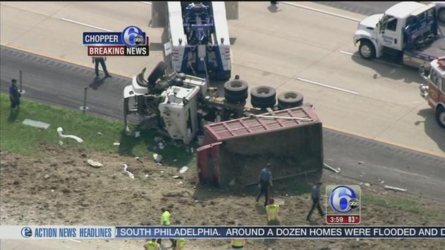 VIDEO: Dump truck overturns on Route 1