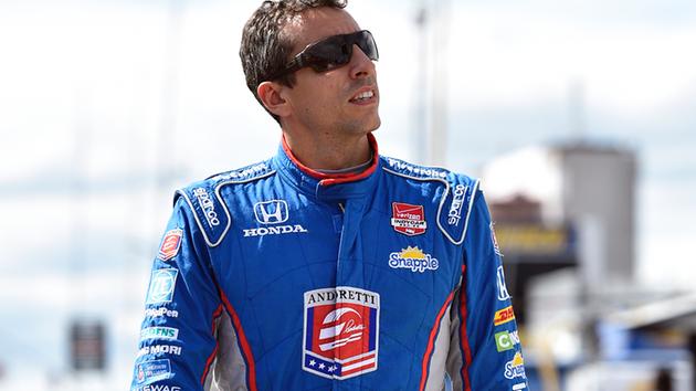 Justin Wilson, of England, walks on pit road during qualifying for Sundays Pocono IndyCar 500 auto race, Saturday, Aug. 22, 2015, in Long Pond, Pa. 