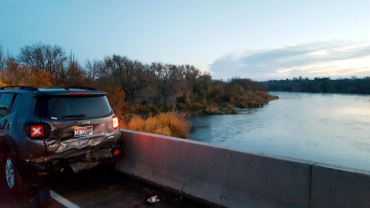 Hit by car, man falls into icy river, swims to safety