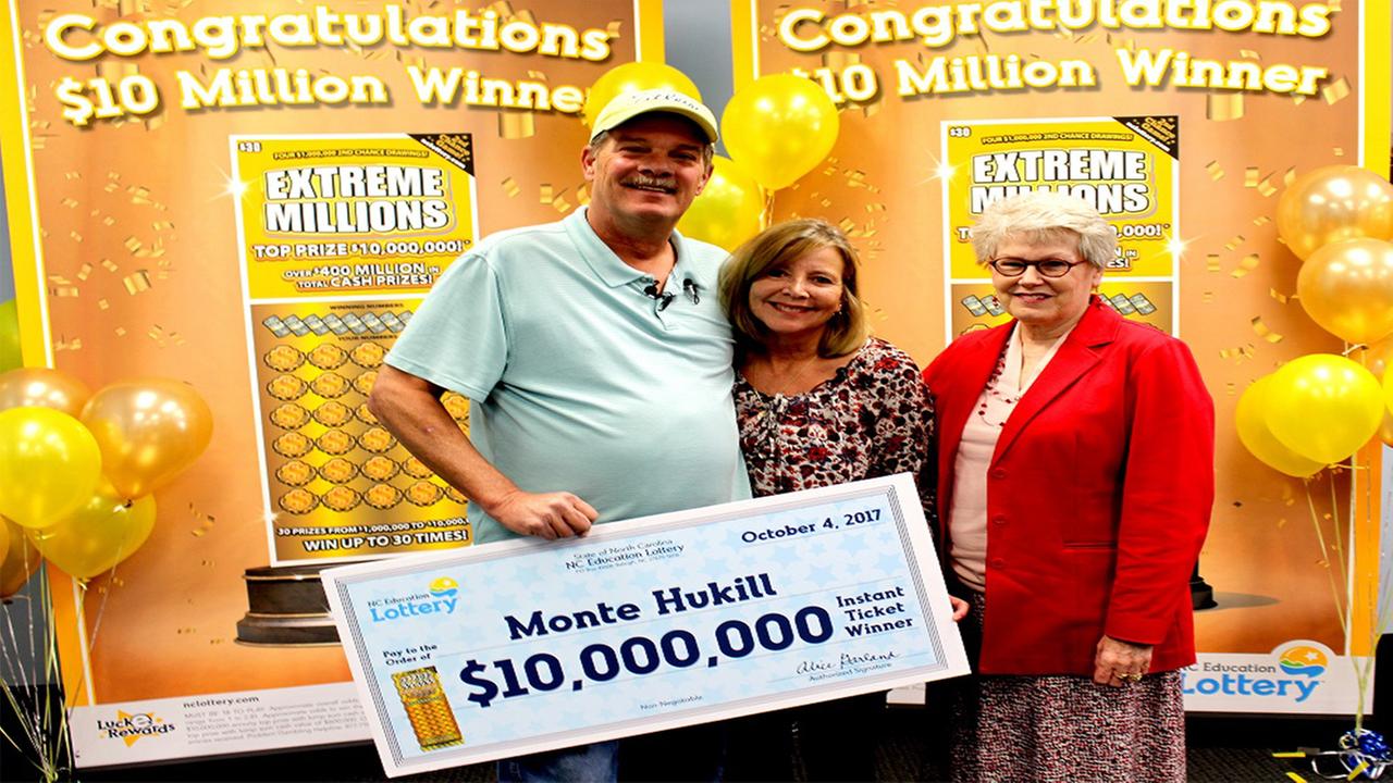 Monte Hukill and his wife Gage claiming their prize