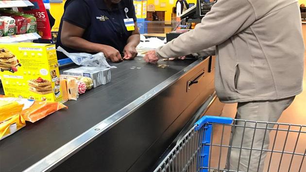 Walmart cashier helps man struggling to count change