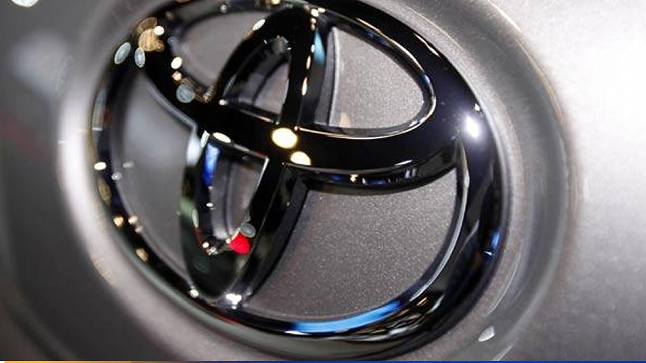 In this March 31, 2010 file photo, the Toyota logo is seen on a car displayed at the New York International Auto Show in New York.